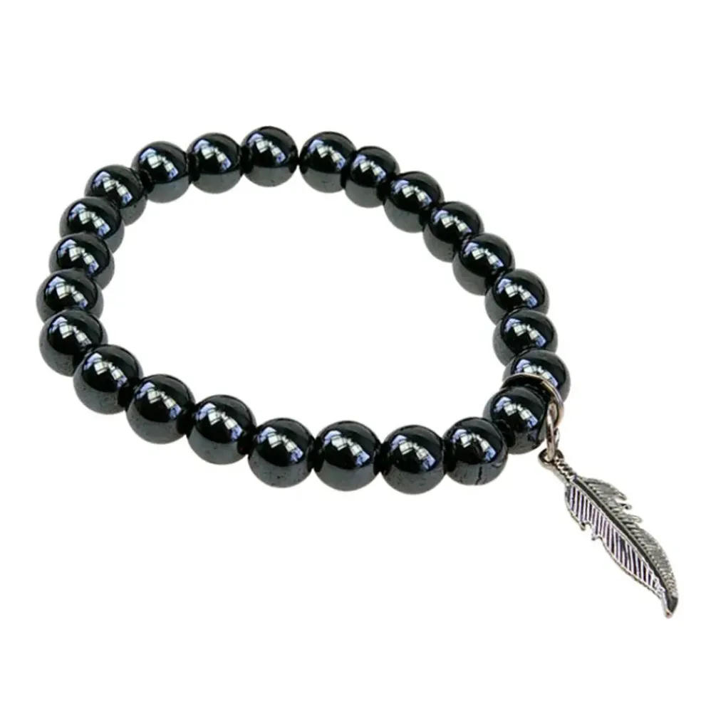 Bracelet hématite perles rondes 8mm et plume